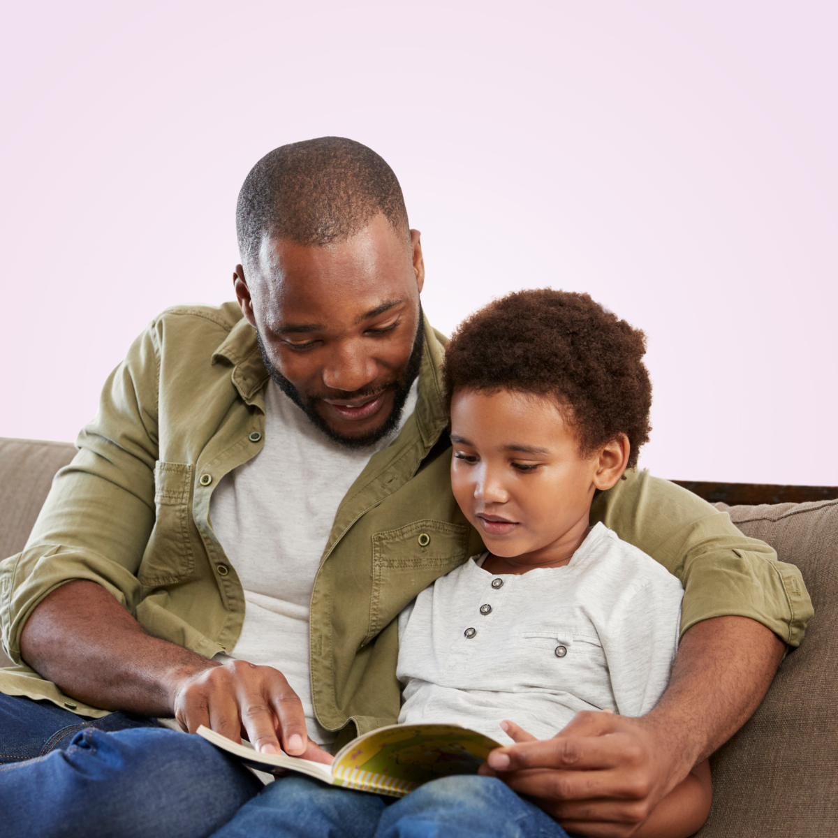 man reading to boy