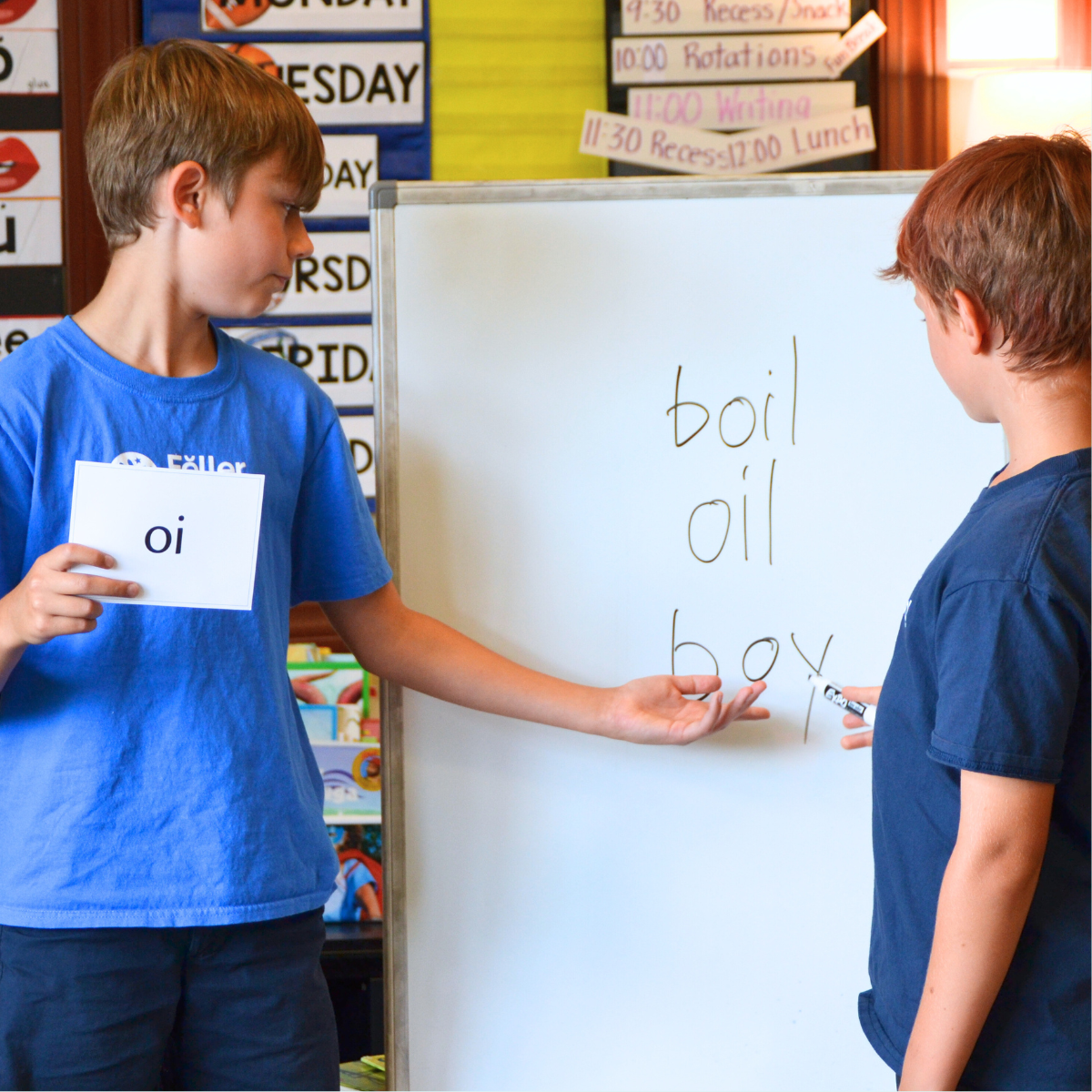student explaining a spelling rule to class