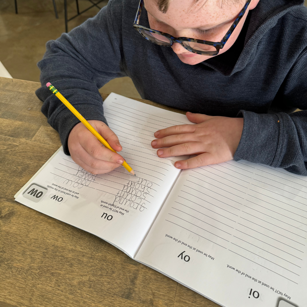 student writing in spelling journal