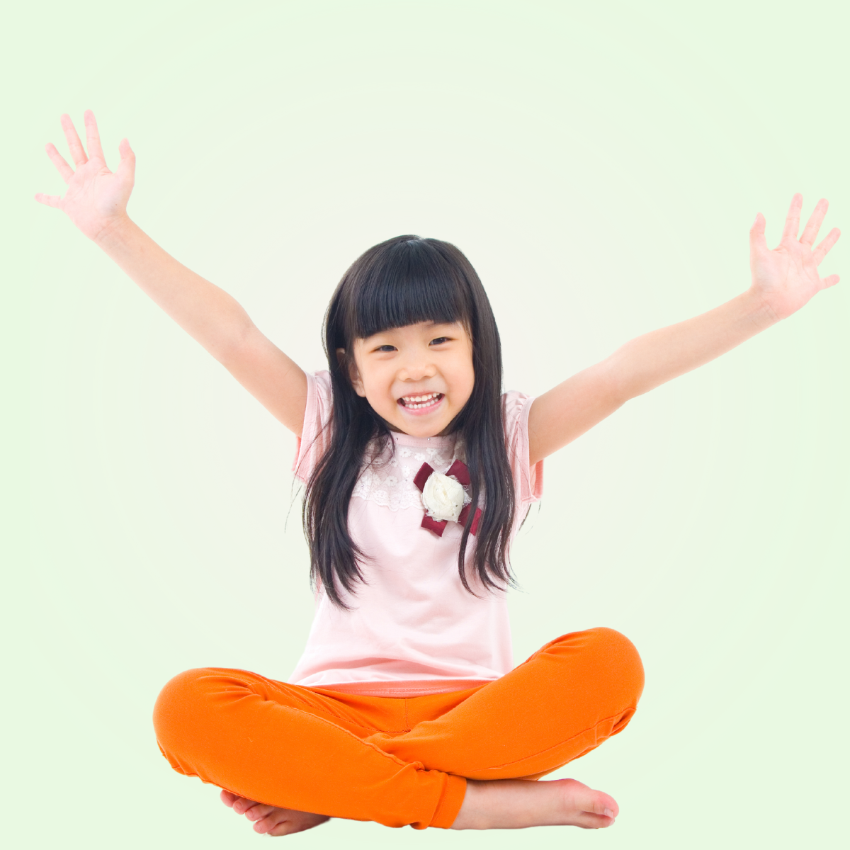 student sitting with arm outstretched