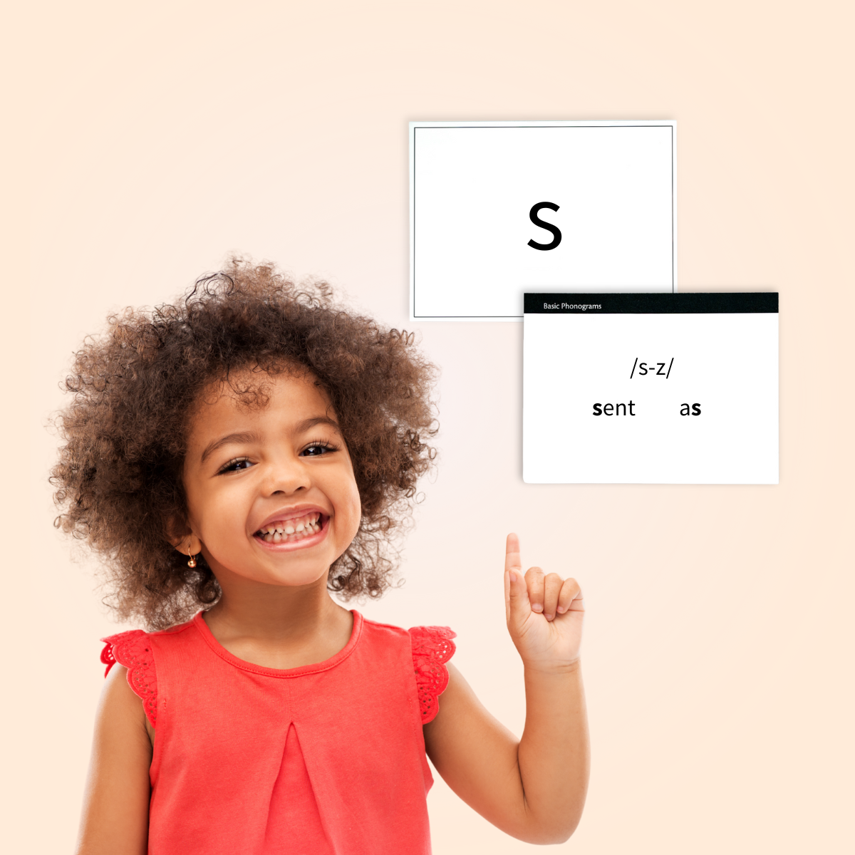 student pointing up to phonogram flashcards