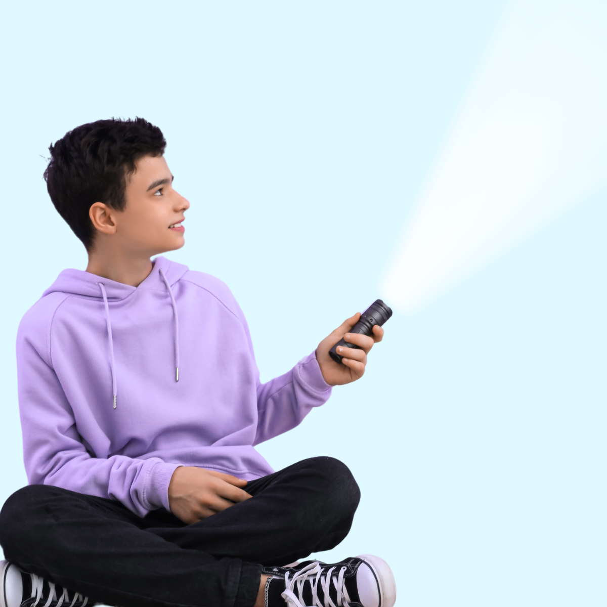 student with flashlight