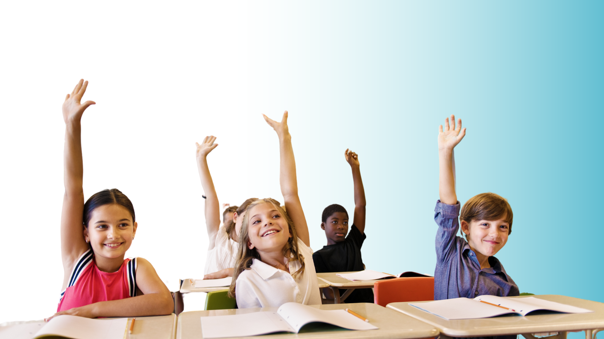 students at desks with hands raised