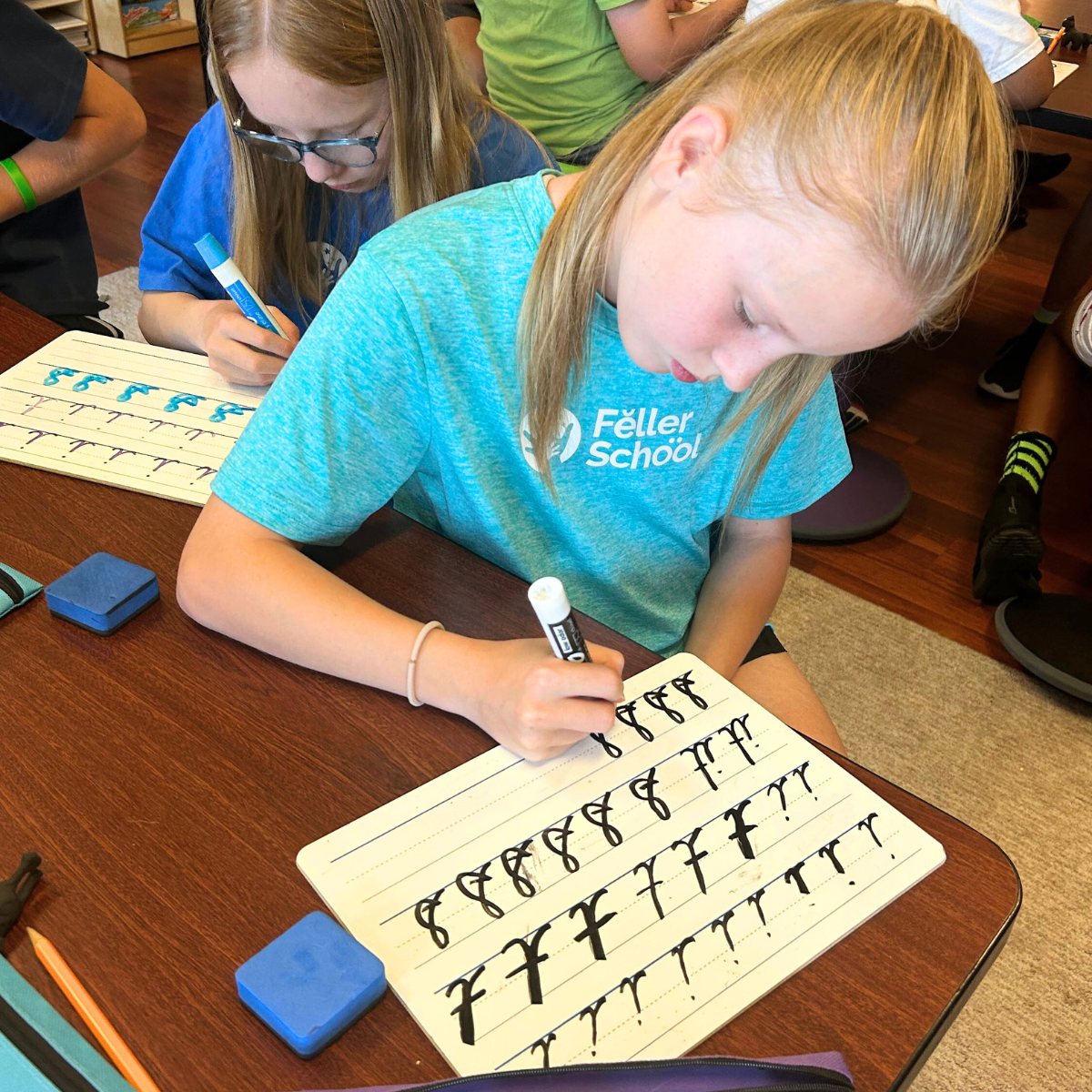 students practicing cursive handwriting