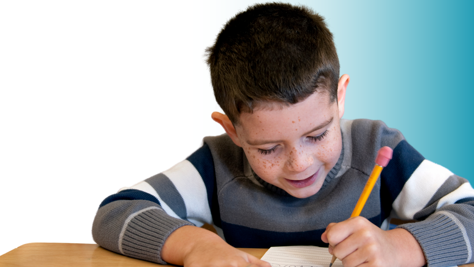 student writing at desk