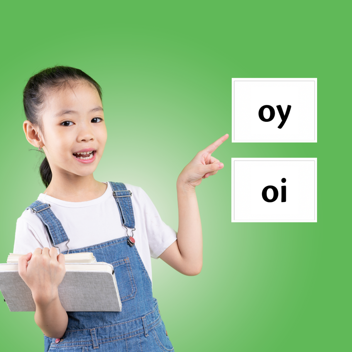 student pointing to OY phonogram flashcard