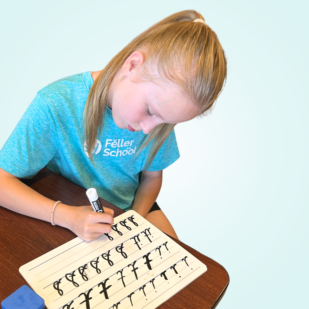 student practicing cursive handwriting