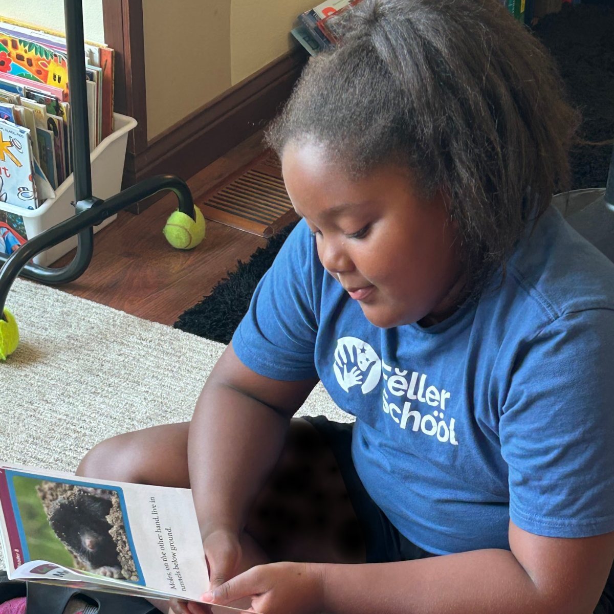 young girl reading controlled reader