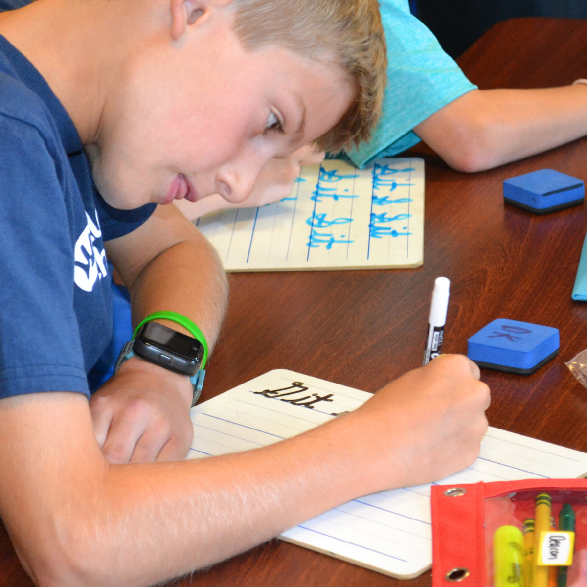 student practicing cursive handwriting
