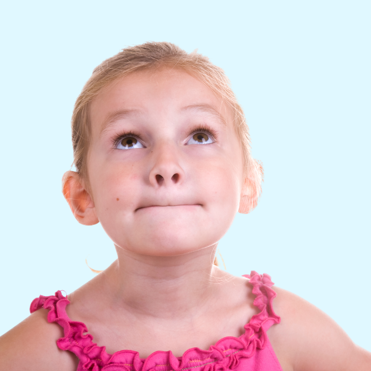 child with lips pursed together