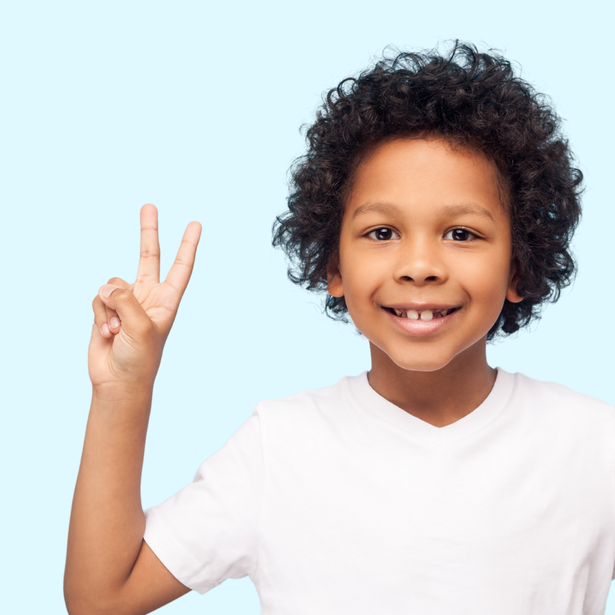 boy holding two fingers up