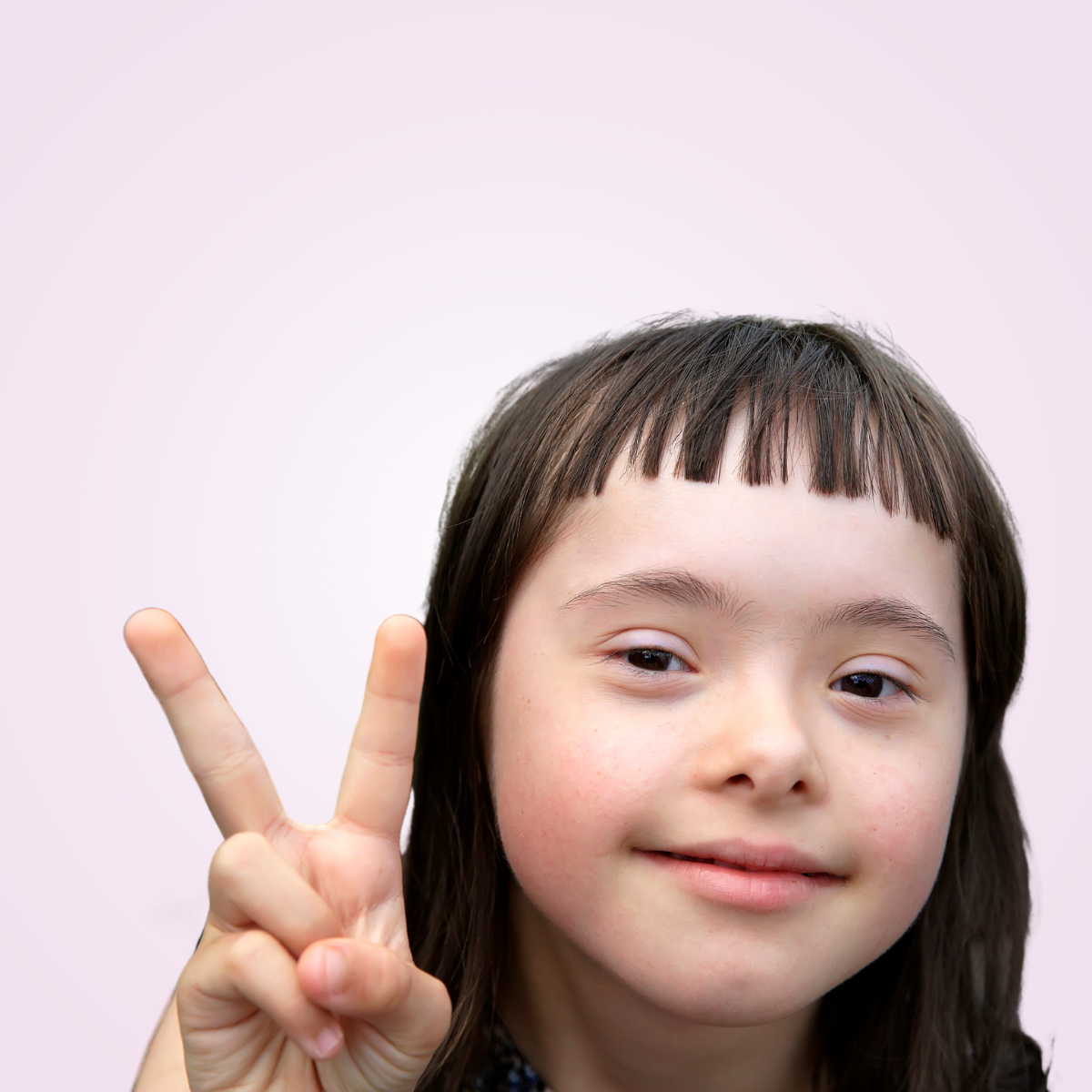 girl holding up two fingers